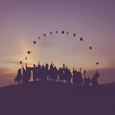 aerial view of a large group of graduates wearing caps